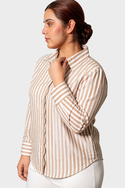 A woman wearing a beige and white vertically striped button-down shirt, shown in a side profile against a light gray studio background.